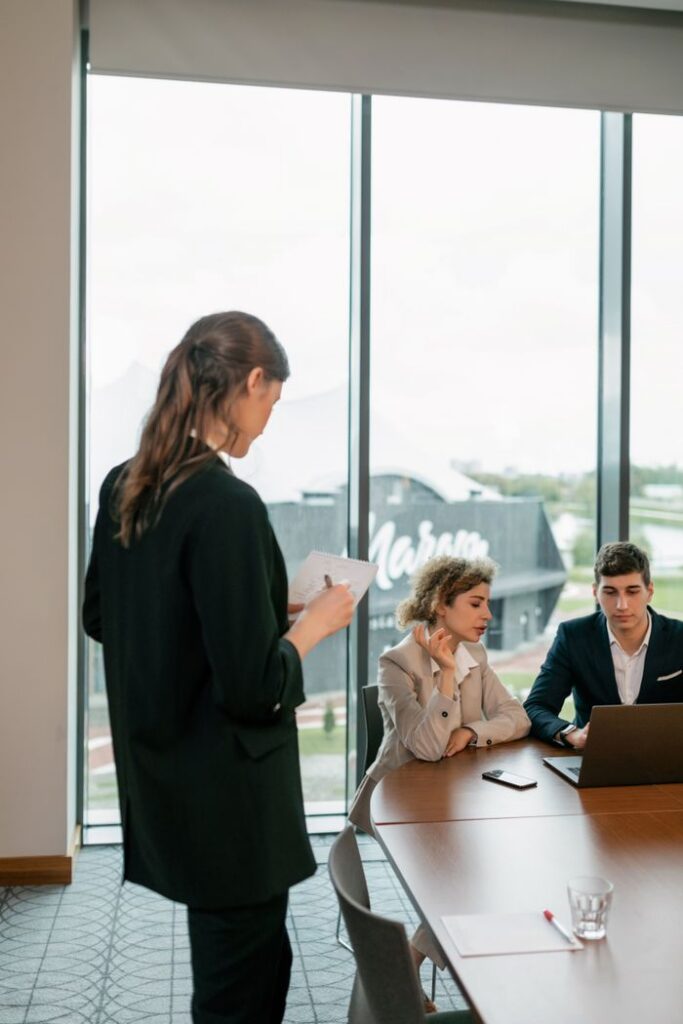 Teamwork in action as business professionals collaborate on a project in a modern office setting.